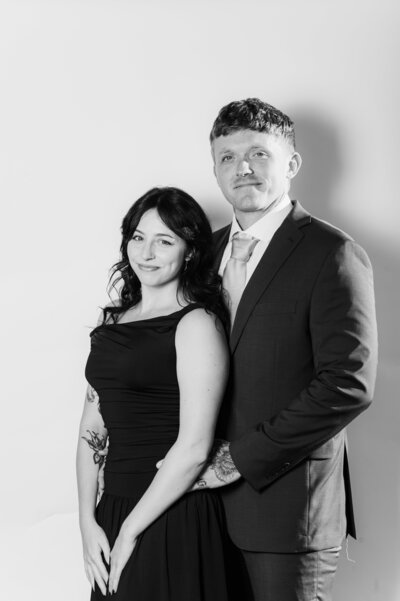 Black and white portrait of a couple posing elegantly together at a Vogue Portrait photo booth in Richmond, VA.