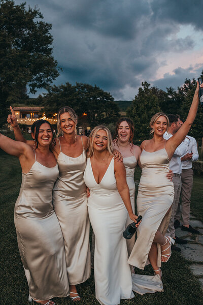 bride with bridesmaids celebrating