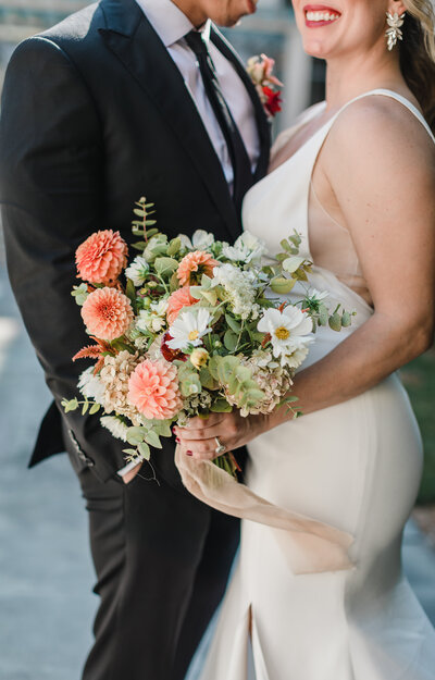 Cincinnati Couple Holding Flowers at their Wedding