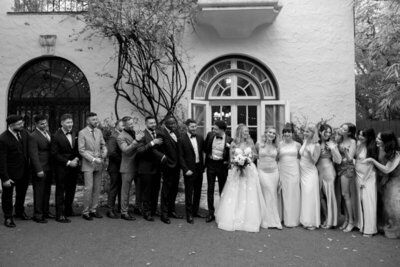 Bridal party in front of wedding venue, taken by one of the best photographers in orlando fl
