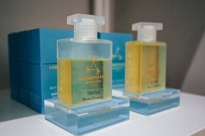 Two bottles of aromatherapy associates oil for treatments at Missy's Beauty Nantwich