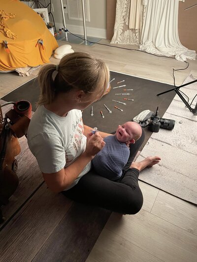 Behind the scenes at a newborn session in Charlotte NC