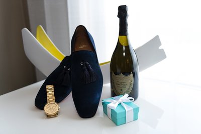 Blue suede Christian Louboutin  Loafers,  Dom Perignon and a blue Tiffany jewelry box