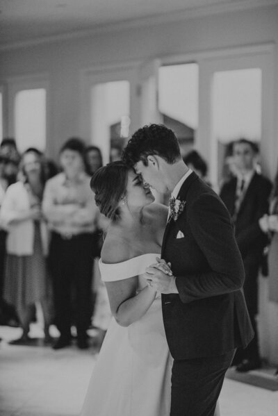 bride & groom joyfully smiling at the camera