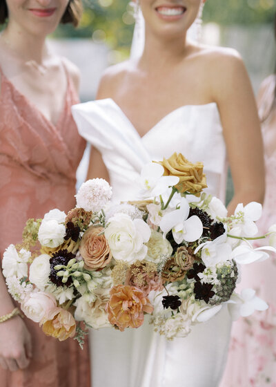 Floral bouquet held by bride