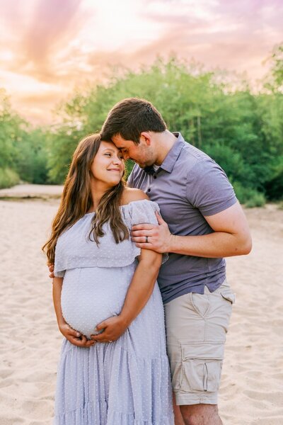 maternity photos wife and husband beach