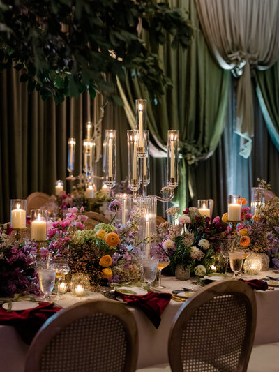 Couple sitting on a dock holding hands
