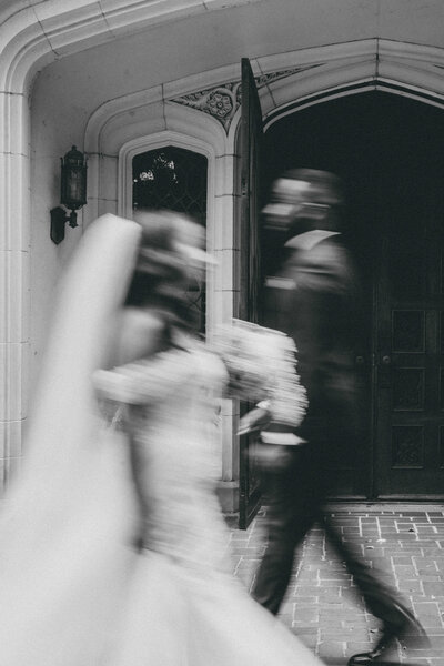 bride and groom walking by each other