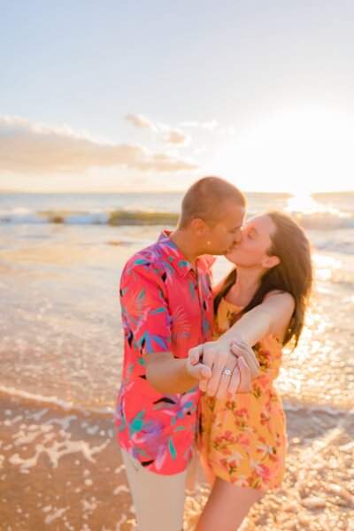 Couple soak up the beautiful Maui beach landscape during their Maui proposal photoshoot