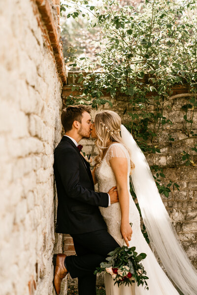 bride-and-groom-looking-into-each-others-eyes-down-country-lane