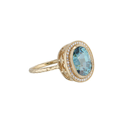 Large blue oval zircon and gold ring