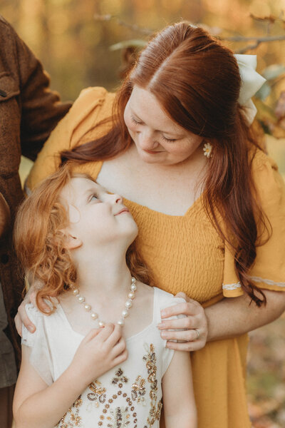 Blacksburg, Virginia photographer, Melena Lawson, smiles at her daughter. 