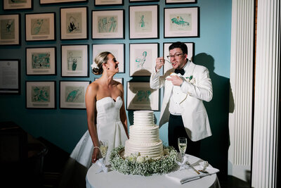 newlyweds in sunglasses walk on grass
