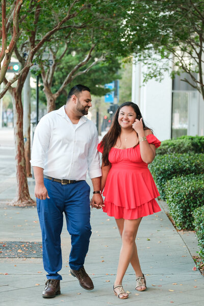 Engaged couple dance on a light and airy St. Pete beach