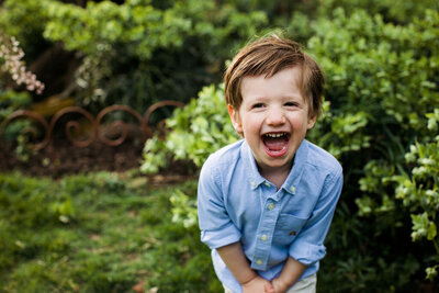 A young boy with a big smile on his face