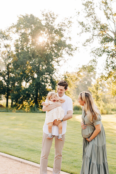 pregnant mother with her family during a maternity photography session