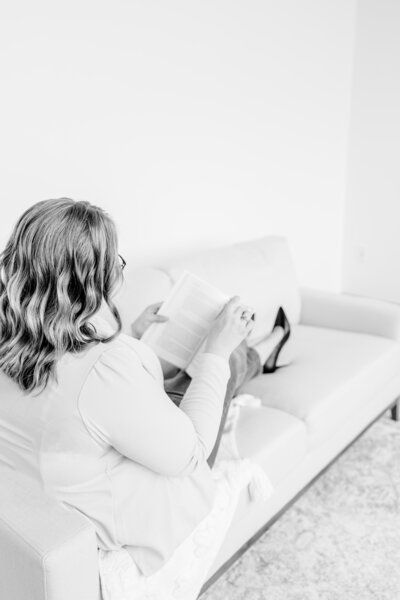 brittany reading on a couch