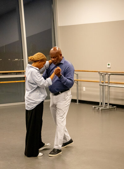Couple doing their dance in Curtsy Ballroom