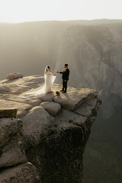 bride and groom getting married at Taft Point in Yosemite national park