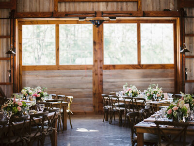 Wooden tables decorated with floral centerpieces