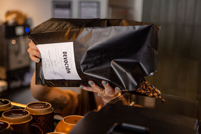 tea in clear glass cup with fruit in it on wooden surface