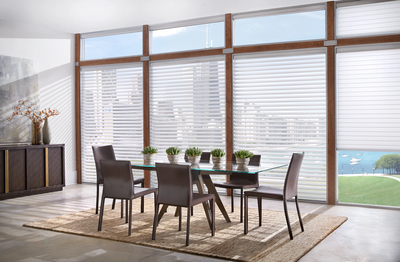 Transparent shades in a dining room with a city view