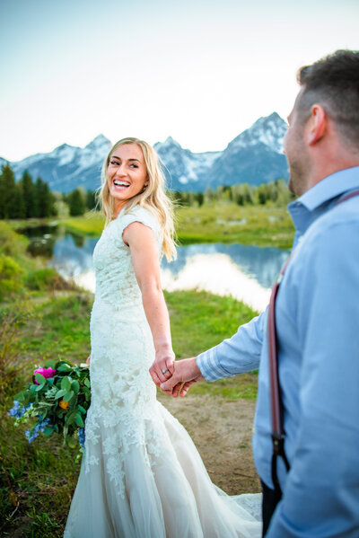 Jackson Hole photographers capture bride leading groom