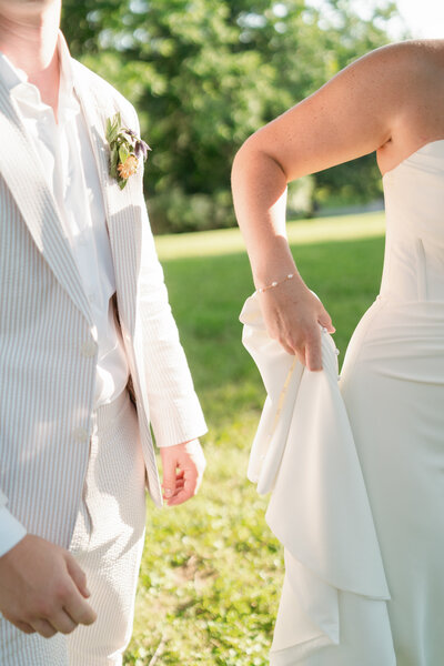 A young bridal couple swing dancing after their morning wedding outside of Austin, Texas. 