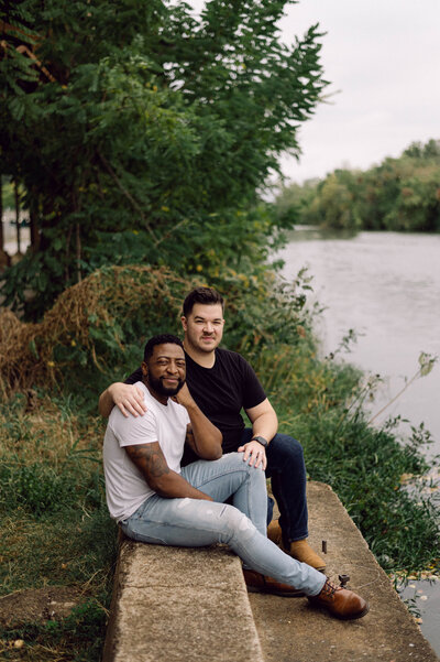 Micah and Dough sitting together on a bench in Richmond, VA.