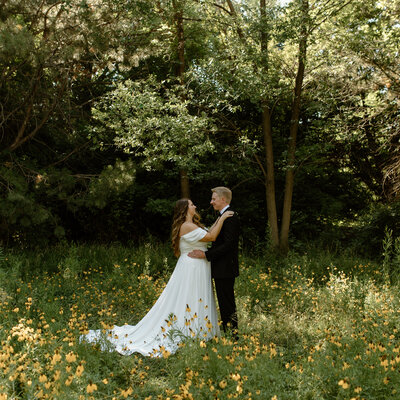 Newlyweds Allie and James following their wedding ceremony at Marianne Williams Park, before their reception at the Linen Building in Downtown Boise, captured by Andra Krista Photography