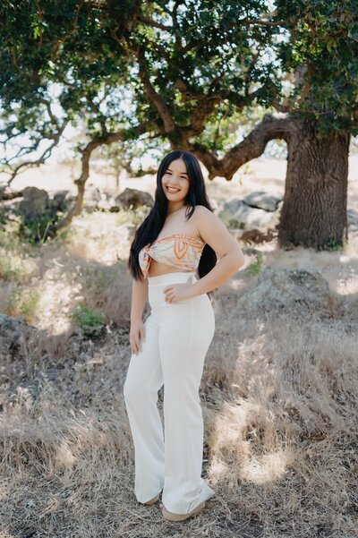 Los Angeles Wedding photographer Marianne Lucas & Victor's eldest daughter. Family pictures 2019. She is wearing a mustard knit long sleeved dress. Alexis has short shoulder length black hair.