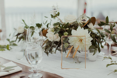 table with glasses and white flowers