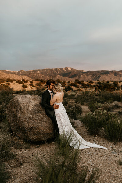 eloping couple hugging at the foothills in Albuquerque