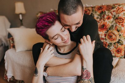 same sex couple embracing during photo shoot