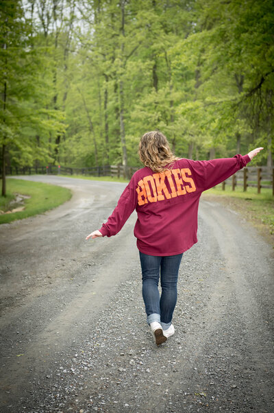 senior girl outdoor senior picture with Hokie shirt