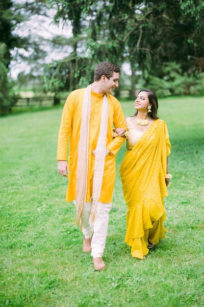 bride and groom posing during sunset