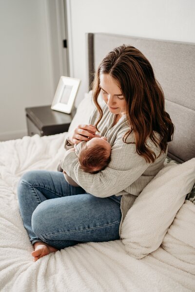 New mom cuddling with baby at home in North Dakota