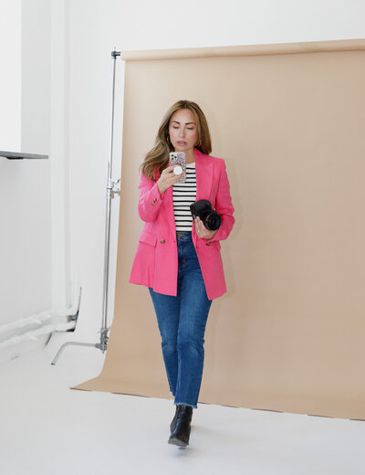 photographer in pink blazer