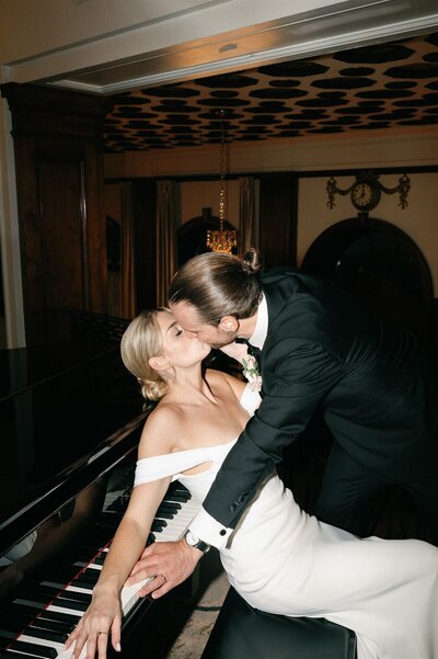 Wedding couple pose with a kiss at Lord Nelson Hotel wedding reception