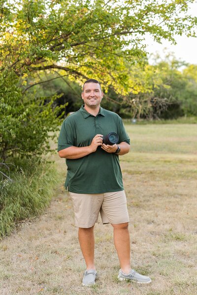 Photographer holding camera near Wichita, KS