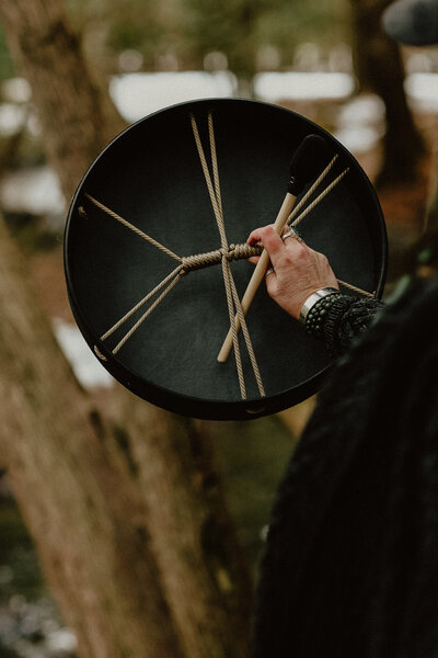 holding drum, sound journey in forest