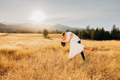 Engagement photo Missoula couple doing a dip at Blue Mountain Trailhead