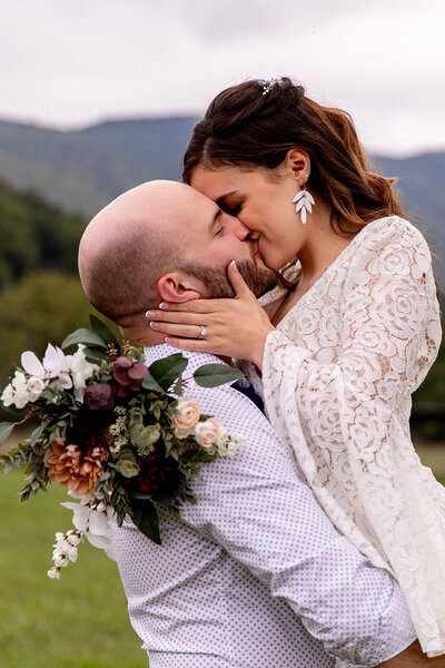 groom holding bride