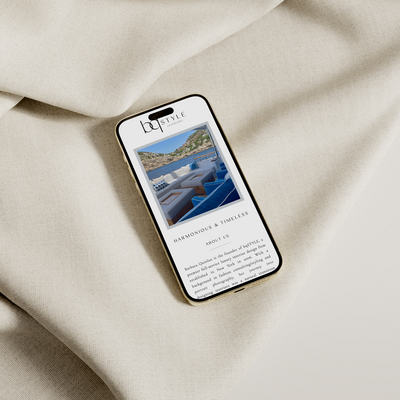 iPhone mockup of bq Style homepage with neutral textile background.