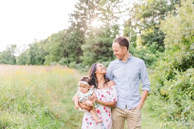 family smiles during family photo session at. heard farm with  Sara Sniderman  Photography