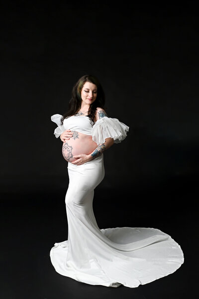 In studio flowy photo of a mom to be