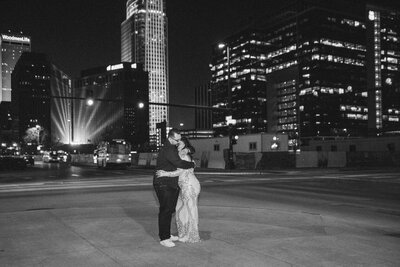 bride and groom at night in downtown Omaha