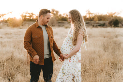 couple walking away on bridge