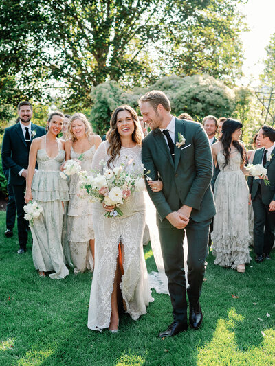 Newlyweds celebrating an outdoor spring wedding in Michigan.