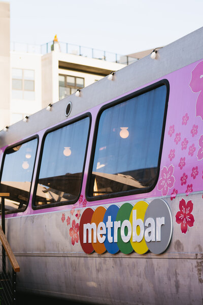 A photo of a mobile bar called "Metrobar" at a local event